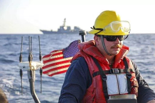 In this photo released by the U.S. Navy, Boatswain's Mate 2nd Class Hunter Pemberton, assigned to the USS Cole, takes part in an exercise on the Red Sea, March 29, 2022. Mohammed Abdul-Salam, Yemen's Houthi chief negotiator and spokesman, said late Friday, April 15, that the U.S. move in the Red Sea, which comes amid a cease-fire in the country's civil war, contradicts Washington’s claim of supporting the U.N.-brokered truce. (Mass Communication Specialist Seaman Christopher Stachyra/U.S. Navy