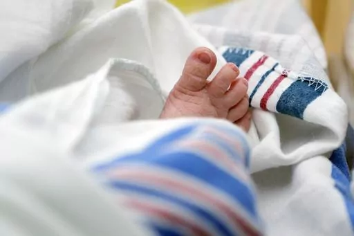 The toes of a baby are seen DHR Health, July 29, 2020, in McAllen, Texas. Dutton and Wrenlee are on the rise but they’re no match for champs Liam and Olivia as the top baby names in the U.S. last year. (AP Photo/Eric Gay, File)