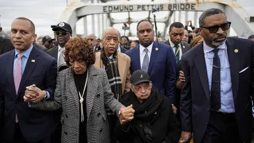 U.S. Rep. Hakeem Jeffries, D-NY, U.S. Rep. Maxine Waters, D-Calif., Rev. Al Sharpton, Rev. Jesse Jackson and NAACP President Derick Johnson, from left, march across the Edmund Pettus bridge during the 60th anniversary of the march to ensure that African Americans could exercise their constitutional right to vote, Sunday, March 9, 2025, in Selma, Ala. (AP Photo/Mike Stewart)