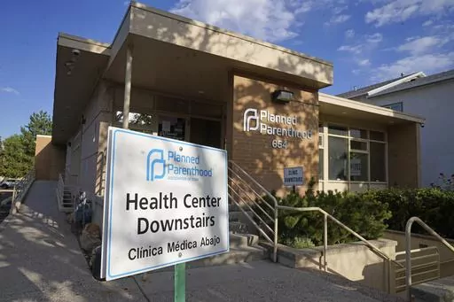 A sign is shown in front of Planned Parenthood of Utah Tuesday, June 28, 2022, in Salt Lake City. Utah Gov. Spencer Cox signed legislation on Wednesday, March 15, 2023, that will effectively ban clinics from providing abortions, setting off a rush of confusion among clinics, hospitals and prospective patients in the deeply Republican state. With the law set to start taking effect May 3, both the Planned Parenthood Association of Utah and the Utah Hospital Association declined to detail how the i