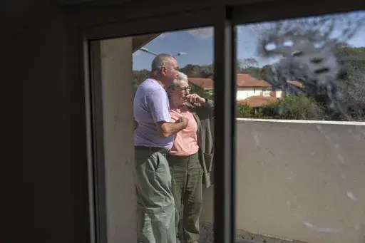 Pete and Gillian Brisley visit the home of their daughter, who was killed along with her two daughters in Hamas' Oct. 7 attack, and their son-in-law, who was taken captive, in Kibbutz Be'eri, southern Israel, Wednesday, Feb. 21, 2024. (AP Photo/Ohad Zwigenberg, File)