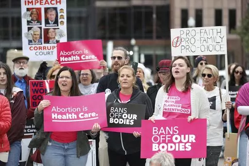 Supporters of Issue 1, the Right to Reproductive Freedom amendment, attend a rally held by Ohioans United for Reproductive Rights at the Ohio Statehouse in Columbus, Ohio, Sunday, Oct. 8, 2023. The Ohio Supreme Court, Friday, Dec. 15, has dismissed the state’s challenge to a judge’s order that has blocked enforcement of Ohio's near-ban on abortions for the past 14 months.(AP Photo/Joe Maiorana, File)