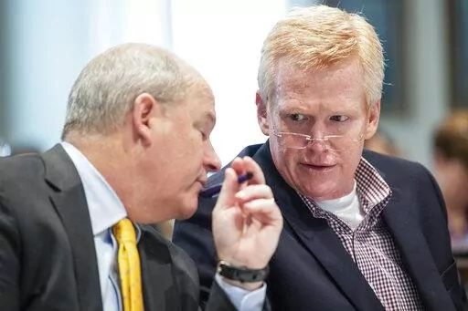 Alex Murdaugh and his defense attorney Jim Griffin listen to testimony during Murdaugh's double murder trial at the Colleton County Courthouse on Wednesday, Feb. 8, 2023, in Walterboro, S.C. The 54-year-old attorney is standing trial on two counts of murder in the shootings of his wife and son at their Colleton County home and hunting lodge on June 7, 2021. (Joshua Boucher/The State via AP, Pool)