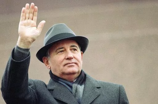 Soviet President Mikhail Gorbachev waves from the Red Square tribune during a Revolution Day celebration, in Moscow, Soviet Union, Tuesday, Nov. 7, 1989. Russian news agencies are reporting that former Soviet President Mikhail Gorbachev has died at 91. The Tass, RIA Novosti and Interfax news agencies cited the Central Clinical Hospital. (AP Photo/Boris Yurchenko, File)