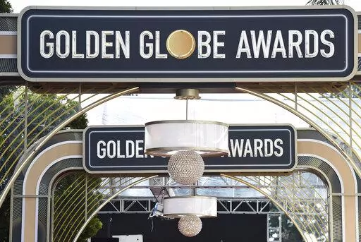 Event signage appears above the red carpet at the 77th annual Golden Globe Awards on Jan. 5, 2020, in Beverly Hills, Calif. The 80th annual Golden Globe Awards will take place on Tuesday, Jan. 10. (Photo by Jordan Strauss/Invision/AP, File)