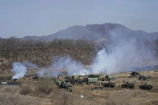 U.S. Army's armored vehicles prepare to cross the Hantan river at a training field in Yeoncheon, near the border with North Korea, Monday, March 13, 2023. The South Korean and U.S. militaries launched their biggest joint military exercises in years Monday, as North Korea said it conducted submarine-launched cruise missile tests in apparent protest of the drills it views as an invasion rehearsal. (AP Photo/Ahn Young-joon)