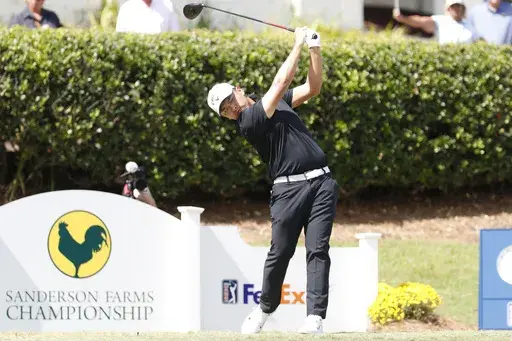 Kevin Yu watches his ball after teeing off from the first hole during the fourth round of the 2024 Sanderson Farms Championship at the Country Club of Jackson on Oct. 06, 2024, in Jackson, Miss. (AP Photo/Sarah Warnock).