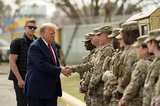 Republican presidential candidate former President Donald Trump greets members of the National Guard on the U.S.-Mexico border, Feb. 29, 2024, in Eagle Pass, Texas. (AP Photo/Eric Gay, File)