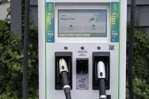 A charging station with Combined Charging System (CCS) plugs is seen in Anaheim, Calif., Friday, June 9, 2023. Owners of General Motors and Ford electric vehicles will be able charge at many of Tesla's large network of stations across the U.S. starting next year. (AP Photo/Jae C. Hong)