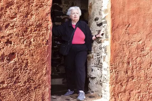 U.S. Treasury Secretary Janet Yellen stands in the "Door Of No Return" on Goree Island, Senegal, Saturday Jan. 21, 2023. Yellen has paid a solemn visit to an island off Senegal that is one of the most recognized symbols of the horrors of the Atlantic slave trade that trapped tens of millions of Africans in bondage. She is in Senegal as part of a 10-day trip aimed at rebuilding economic relationships between the U.S. and Africa. (AP Photo/Stefan Kleinowitz)