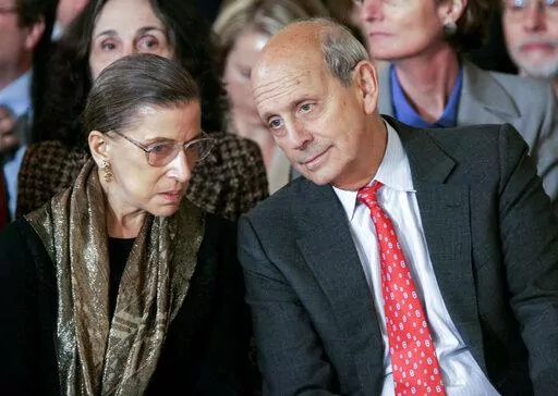 Supreme Court Associate Justices Ruth Bader Ginsburg, left, and Stephen Breyer talk prior to a ceremonial swearing-in ceremony for new Supreme Court Justice Samuel Alito in the East Room of the White House, Feb. 1, 2006. (AP Photo/Gerald Herbert, File)