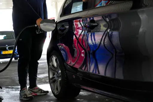 Motorists in the Netherlands headed to the pumps after a government reduction in duties on fuel entered into force to help motorists hit by soaring fuel prices, in Amsterdam, Netherlands, Friday, April 1, 2022. Inflation hit a new record for the 19 countries that use the euro as skyrocketing fuel prices boosted by the war in Ukraine add new burdens to household finances and weigh on a slowing economic recovery from the latest outbreaks of COVID-19, the European Union's statistics agency Eurostat