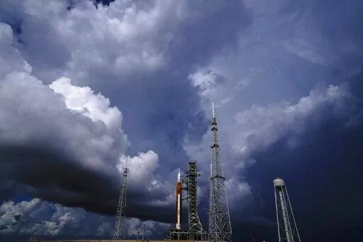 The NASA moon rocket stands on Pad 39B before a launch attempt for the Artemis 1 mission to orbit the moon at the Kennedy Space Center, Friday, Sept. 2, 2022, in Cape Canaveral, Fla. On Friday, Sept. 23, 2022, a storm in the Caribbean is threatening to delay NASA's third attempt to launch the rocket. (AP Photo/Brynn Anderson, File)
