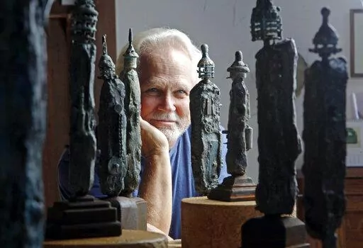 Tony Dow, actor, director and artist, poses with some of his works at his home and studio in the Topanga area of Los Angeles, Thursday, Sept. 18, 2012. “Leave It to Beaver” actor Dow has died at age 77. Frank Bilotta, who represented Dow in his work as a sculptor, confirmed his death in an email to The Associated Press on Wednesday, July 27, 2022. (AP Photo/Reed Saxon, File)