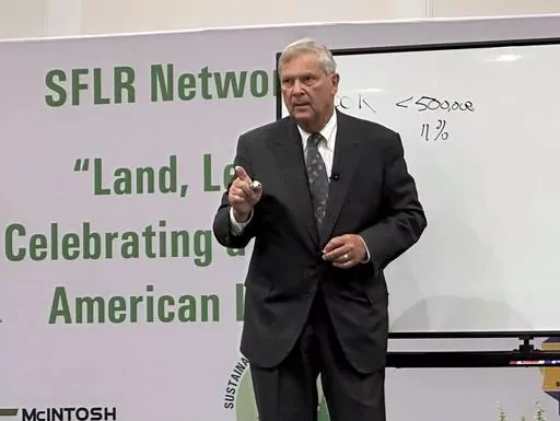 U.S. Agriculture Secretary Tom Vilsack speaks to a conference of Black forestland owners in Brunswick, Ga., on Tuesday, Aug. 22, 2023. Vilsack announced a new Biden administration program that will spend $150 million to help owners of small parcels of forestland partner with companies willing to pay them for carbon offsets and other environmental credits. (AP Photo/Russ Bynum)