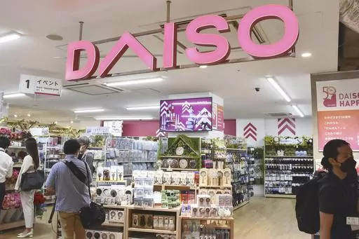 Shoppers visit a Daiso shop as the shop opened to the media in Tokyo, on April 13, 2022. Hirotake Yano, who founded the retail chain Daiso known for its 100-yen shops, Japan’s equivalent of the dollar store, has died. He was 80.(Kyodo News via AP)