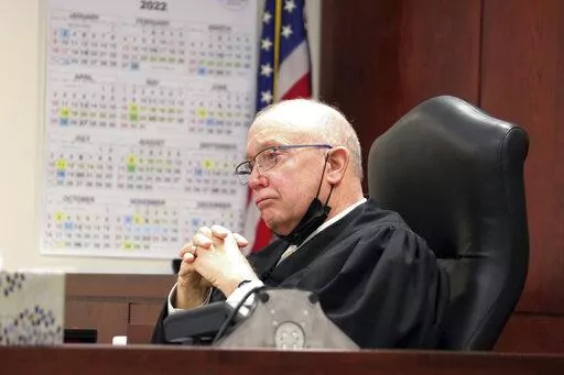 Judge Patrick McAllister listens to arguments during a hearing in court, Thursday, March, 31, 2022 in Bath, N.Y. New York will now hold its congressional and state Senate primaries on Aug. 23, a McAllister ruled Friday. (Vaughn Golden/WSKG via AP, Pool, File)