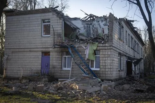A damaged kindergarten following a Russian drone attack in Kyiv, Ukraine, Saturday, Nov. 25, 2023. Russia launched its most intense drone attack on Ukraine since the beginning of its full-scale invasion on Saturday morning, military officials said. (AP Photo/Efrem Lukatsky)