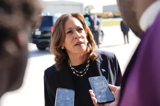Democratic presidential nominee Vice President Kamala Harris talks to the media before boarding Air Force Two at Detroit Metropolitan Wayne County Airport, Thursday, Aug. 8, 2024, in Romulus, Mich. (AP Photo/Julia Nikhinson, File)