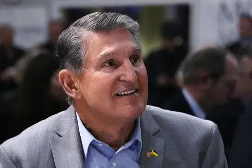 Sen. Joe Manchin, D-W.Va., smiles while being introduced during the 'Politics and Eggs' event, as part of his national listening tour, Friday, Jan. 12, 2024, in Manchester, N.H. As his second term ends as a U.S. senator, Manchin is still not a declared candidate for any office five months before the 2024 general election. But there’s still time to mull potential runs for governor, the Senate, and even the U.S. presidency. (AP Photo/Charles Krupa, File)