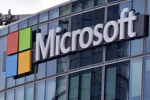 The Microsoft logo is seen in Issy-les-Moulineaux, outside Paris, France, April 12, 2016. In a scathing indictment of Microsoft corporate security and transparency, a Biden administration-appointed review board issued a report Tuesday, April 2, 2024, saying “a cascade of errors” by the tech giant let state-backed Chinese cyber operators break into email accounts of senior U.S. officials including Commerce Secretary Gina Raimondo. (AP Photo/Michel Euler, File)