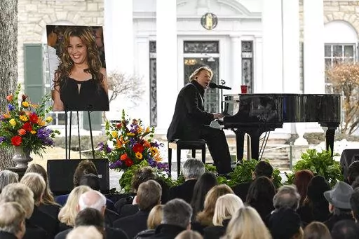 Axl Rose performs during a memorial service for Lisa Marie Presley Sunday, Jan. 22, 2023, in Memphis, Tenn. She died Jan. 12 after being hospitalized for a medical emergency and was buried on the property next to her son Benjamin Keough, and near her father Elvis Presley and his two parents. (AP Photo/John Amis)