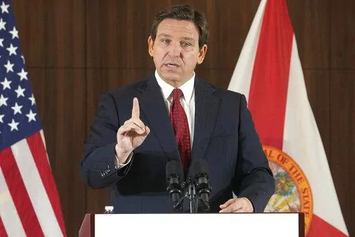 Florida Gov. Ron DeSantis gestures during a news conference, Thursday, Jan. 26, 2023, in Miami. DeSantis on Tuesday, Jan. 31, 2023, announced plans to block state colleges from having programs on diversity, equity and inclusion, and critical race theory. (AP Photo/Marta Lavandier, File)