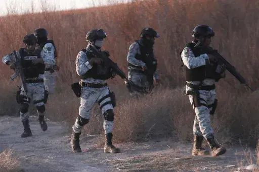 Mexican National Guard members patrol along the Mexico-US border in Ciudad Juarez, Wednesday, Feb. 5, 2025. (AP Photo/Christian Chavez)