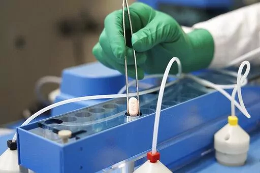 This image provided by Pfizer shows the company's COVID-19 Paxlovid pills. Pfizer's and Merck's COVID-19 pills that were supposed to be an important weapon against the pandemic in the U.S. are in short supply and have played little role in the fight against the omicron wave of infections. (Pfizer via AP, File)