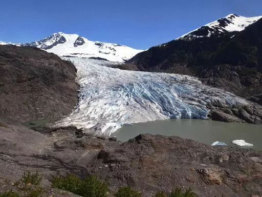 Chunks of ice float on Mendenhall Lake in front of the Mendenhall Glacier on Monday, May 30, 2022, in Juneau, Alaska. A study of all of the world's 215,000 glaciers published on Thursday, Jan. 5, 2023, finds even if with the unlikely minimum warming of only a few tenths of a degrees more, the world will lose nearly half its glaciers by the end of the century. With the warming we're now on track to get, the world will lose two-thirds of its glaciers and overall glacier mass will drop by one-third