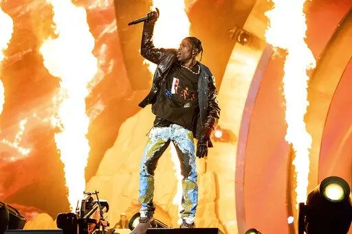 Travis Scott performs at the Astroworld Music Festival in Houston, Nov. 5, 2021. The experiences of panicked concertgoers who couldn’t breathe and had no clear path to escape a massive crowd surge at last year’s deadly Astroworld music festival in Houston are featured in a documentary set for release Friday, April 29, 2022. But lawyers for Live Nation, which is being sued for its role as the festival’s promoter, say they’re concerned that publicity from the documentary, “Concert Crush: