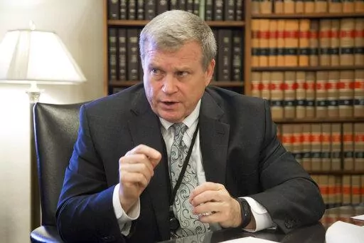 In this March 1, 2017, file photo, Idaho Attorney General Lawrence Wasden speaks during an interview in Boise, Idaho. The false claims that the 2020 election was stolen from former President Donald Trump and protecting future election results loom large over this year’s races for state attorneys general. Candidates who support Trump’s position are angling to unseat Democratic incumbents in political swing states – and in some cases, knock out moderate attorneys general in GOP primaries. (D
