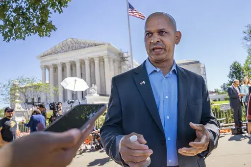 Former U.S. Capitol Police Sgt. Aquilino Gonell, who defended the Capitol on Jan. 6, is interviewed outside of the Supreme Court, July 1, 2024, after the court decision o the immunity case of former President Donald Trump, in Washington. (AP Photo/Jacquelyn Martin, File)