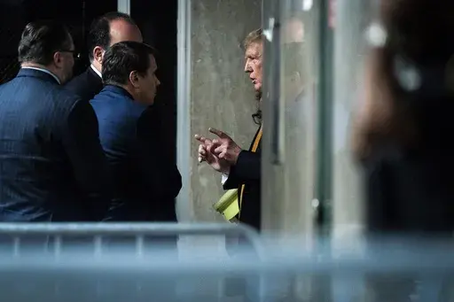 Former President Donald Trump speaks with attorney Todd Blanche and staff outside of the courtroom as jurors began deliberations for his criminal trial at Manhattan Criminal Court in New York on Wednesday, May 29, 2024. Trump was charged with 34 counts of falsifying business records last year, which prosecutors say was an effort to hide a potential sex scandal, both before and after the 2016 presidential election. Trump is the first former U.S. president to face trial on criminal charges. (Jabin