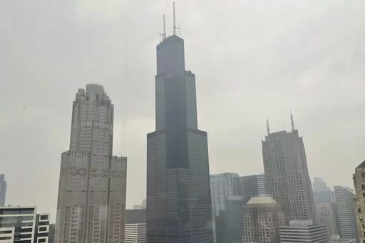The Willis Tower (formerly Sears Tower) is pictured in downtown Chicago, where the air quality has been categorized "unhealthy" by the U.S. Environmental Protection Agency, on June 27, 2023. The EPA says extensive swaths of the northern United States awoke to unhealthy air quality Monday, July 17, or were experiencing it by midafternoon. Fine particle pollution caused by smoke from Canada’s wildfires is causing a red zone air quality index, meaning it is unhealthy for everyone. (AP Photo/Clair