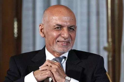 FILE - Afghan President Ashraf Ghani is seated after his meeting with U.S. President Joe Biden in Washington, June 25, 2021. In an interview aired by the BBC on Thursday, Dec. 30, 2021, Afghanistan's former president recounts his final hours in office, says he had just minutes to decide to flee and denies an agreement was in the works for a peaceful takeover, disputing accounts of former government officials, Taliban and even a former U.S. negotiator. (AP Photo/Alex Brandon, File)