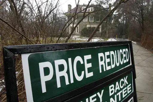 In a Feb. 16, 2012 photo, an existing home is seen for sale in Shaker Heights, Ohio. More homeowners eager to sell their home are lowering their initial asking price in a bid to entice prospective buyers as the spring homebuying season gets going. Some 14.6% of U.S. homes listed for sale last month had their price lowered, according to Realtor.com. That’s up from 13.2% a year earlier, the first annual increase since May, 2023. (AP Photo/Amy Sancetta, file)