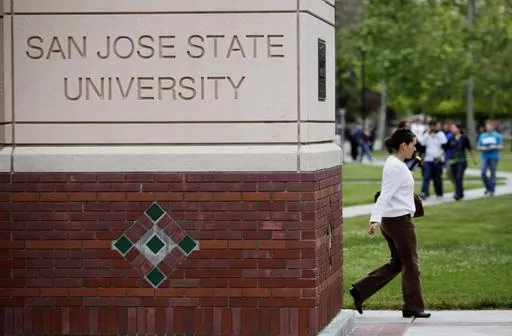 CORRECTS TO SEVEN YEARS INSTEAD OF SIX - FILE - People walk on the campus of San Jose State University in San Jose, Calif., on May 5, 2009. A flawed policy at California State University, the largest higher education system in the country, contributed to the closure of nearly a dozen sexual harassment cases without thorough explanation, a state audit reviewing dozens of cases over the span of seven years found. The state auditor investigated allegations reported by employees at the California St