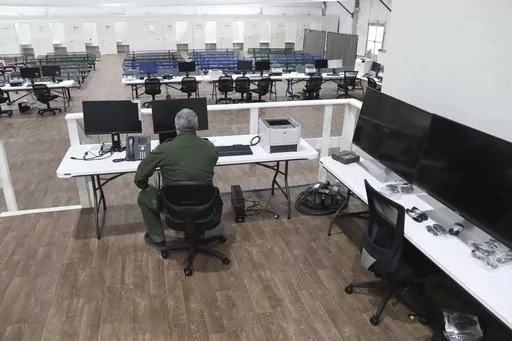 In this photo provided by the U.S. Customs and Border Protection is an interior view of the soft-sided migrant processing facility in Laredo, Texas, on Sept. 23, 2021. As the Biden administration prepared to launch speedy asylum screenings at the border in April, authorities pledged a key difference from a Trump-era version of the policy: Migrants would be guaranteed access to legal representation. Nearly three months and thousands of screenings later, the promise of attorney access appears unfu