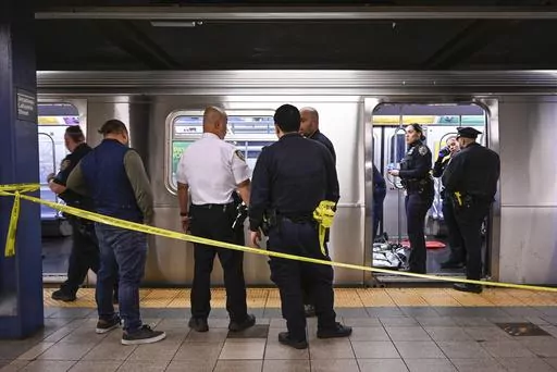 New York police officers respond to the scene where a fight was reported on a subway train, Monday, May 1, 2023, in New York. A man suffering an apparent mental health episode aboard a New York City subway died on Monday after being placed in a headlock by a fellow rider, according to police officials and video of the encounter. Jordan Neely, 30, was shouting and pacing aboard an F train in Manhattan witnesses and police said, when he was taken to the floor by another passenger. (Paul Martinka v