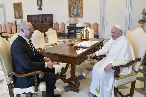 In this picture made available by Vatican Media Ukraine Prime Minister Denys Shmyhal, left, meets with Pope Francis at The Vatican, Thursday, April 27, 2023. (Vatican Media via AP)