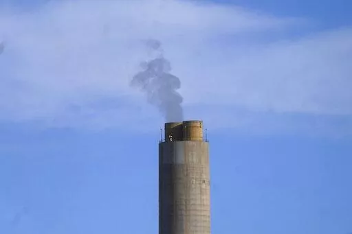 A smokestack stands at a coal plant on June 22, 2022, in Delta, Utah. NASA on Tuesday, Nov. 29, announced that its GeoCarb mission, which was supposed to be a low-cost satellite to monitor carbon dioxide, methane and how plant life changes over North and South America, was being killed because of cost overruns. (AP Photo/Rick Bowmer, File)
