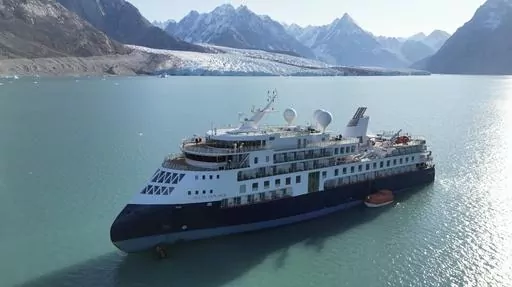 A view of the Ocean Explorer, a Bahamas-flagged Norwegian cruise ship with 206 passengers and crew, which has run aground in northwestern Greenland is pictured on Tuesday, Sept. 12, 2023. The 104.4-meter (343-foot) long and 18-meter (60 foot) wide Ocean Explorer ran aground on Monday in Alpefjord in the Northeast Greenland National Park. Another attempt to pull free a luxury cruise ship with 206 people that ran aground in the world’s northernmost national park has failed by using the high tide