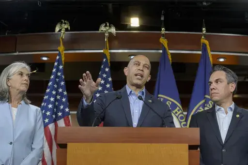 House Minority Leader Hakeem Jeffries, D-N.Y., center, is joined by House Minority Whip Katherine Clark, D-Mass., left, and House Democratic Caucus Chair Pete Aguilar, D-Calif., right, during a news conference at the Capitol, Friday, March 14, 2025, in Washington. (AP Photo/Rod Lamkey, Jr.)