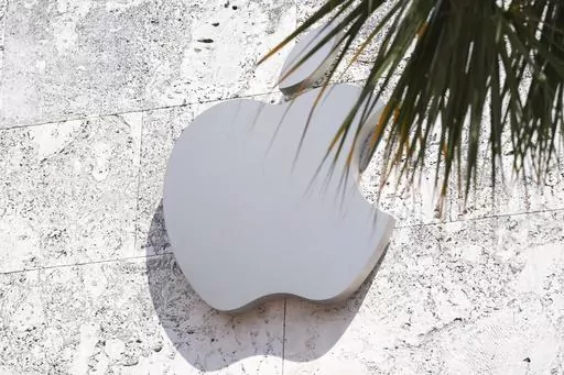 The Apple logo is displayed over their store, Sept. 19, 2023, in Miami Beach, Fla. On Wednesday, Jan. 17, 2024, a federal appeals court decided to revive a U.S. sales ban on Apple's premium watches while it referees a patent dispute revolving around a sensor, raising the specter that the company will pull the devices from stores for the second time in less than a month. (AP Photo/Marta Lavandier, File)