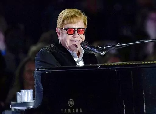 Elton John performs on the South Lawn of the White House in Washington, Friday, Sept. 23, 2022. Elton John is scheduled to perform at the Glastonbury Festival in June, in what organizers say will be his last-ever show in Britain. The festival announced Friday, Dec. 2, 2022 that the star will play the 2023 festival’s final night on June 25 (AP Photo/Susan Walsh, File)
