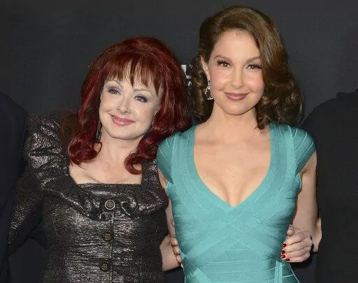 Naomi Judd, left, and Ashley Judd arrive at the LA premiere of "Olympus Has Fallen" in Los Angeles on March 18, 2013. Ashley Judd encouraged people to seek help for their mental health after the loss of her mother, country star Naomi Judd, in an interview on “Good Morning America." Naomi Judd died at the age of 76 on April 30, 2022. (Photo by Jordan Strauss/Invision/AP, File)