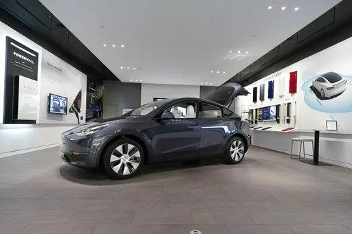 A Tesla Model Y Long Range is displayed on Feb. 24, 2021, at the Tesla Gallery in Troy, Mich. U.S. auto safety regulators have opened an investigation into Tesla’s Model Y SUV after getting two complaints that the steering wheels can come off while being driven. The National Highway Traffic Safety Administration says the probe covers an estimated 120,000 vehicles from the 2023 model year. (AP Photo/Carlos Osorio, File)