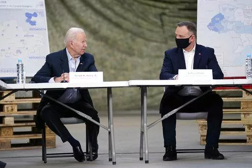 President Joe Biden and Polish President Andrzej Duda participate in a roundtable on the humanitarian response to the Russian invasion of Ukraine, Friday, March 25, 2022, in Jasionka, Poland. (AP Photo/Evan Vucci)