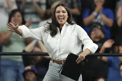 Rep. Alexandria Ocasio-Cortez, D-N.Y., arrives to speak during a "Fighting Oligarchy" tour event at Arizona State University, Thursday, March 20, 2025, in Tempe, Ariz. (AP Photo/Ross D. Franklin)